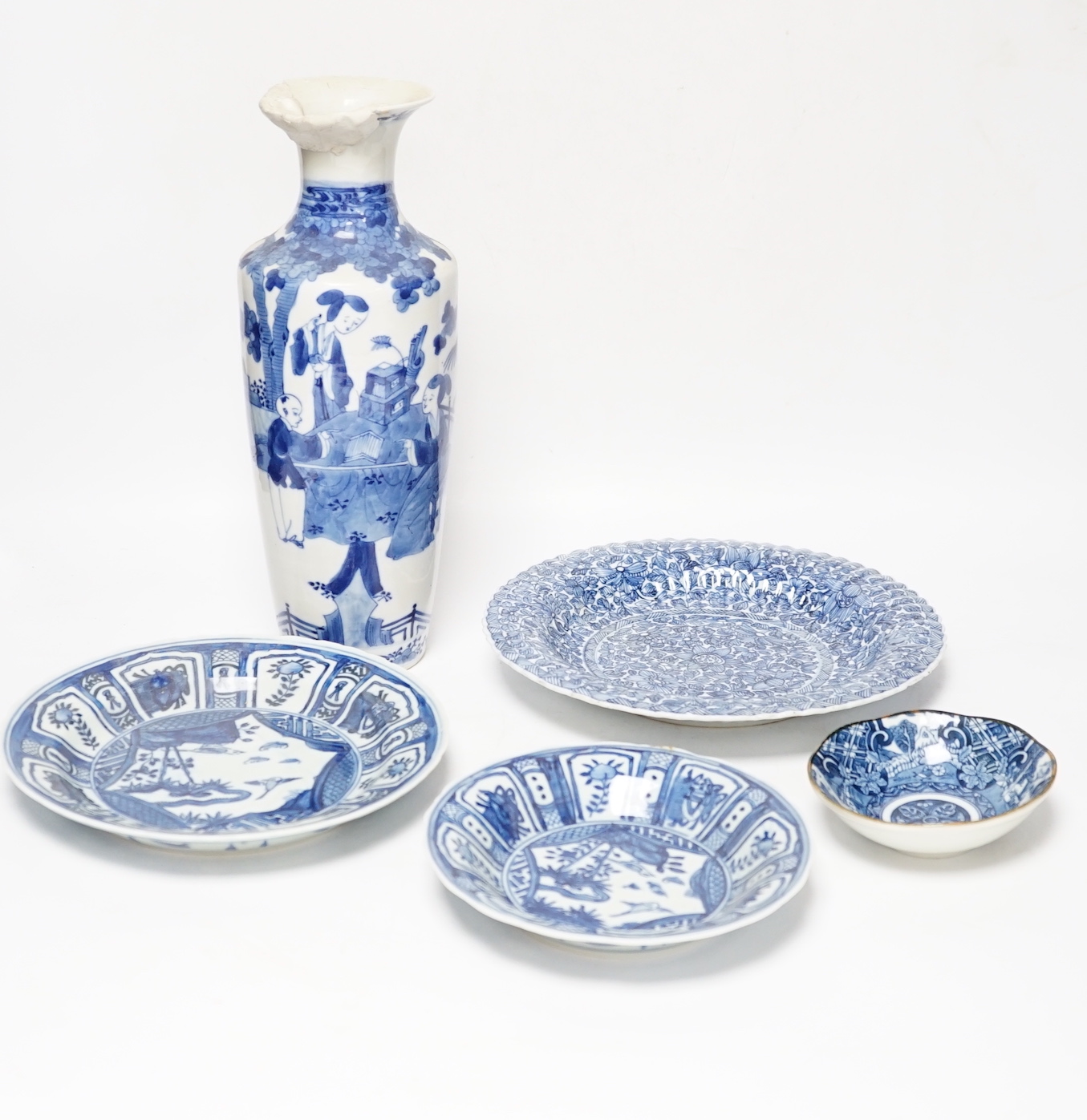 A group of Chinese blue and white dishes and plates and a damaged vase, 30cm